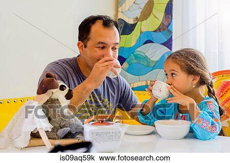 "Mature man, and daughter sharing tea" View Large Photo Image Stock Image - "Mature man, and daughter sharing tea". Fotosearch