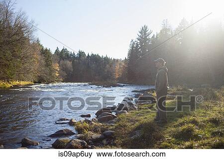 "Mature man gazing out at river, Maine, USA" View Large Photo Image Stock Photo - "Mature man gazing out at river, Maine, USA". Fotosearch