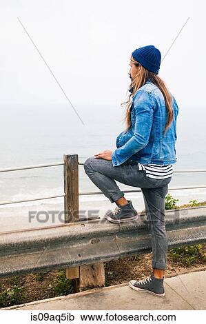 Mid adult man looking at coastal view View Large Photo Image Stock Image - Mid adult man looking at coastal view. Fotosearch