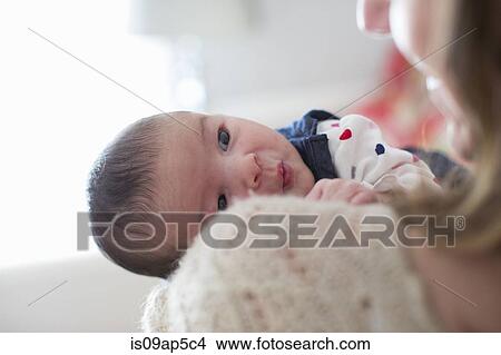 Picture - "Mother holding baby girl, portrait". Fotosearch