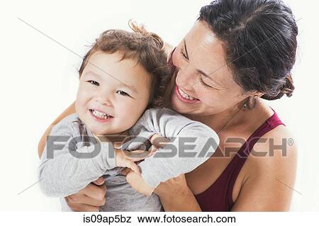 "Mother hugging daughter, smiling" View Large Photo Image Stock Photo - "Mother hugging daughter, smiling". Fotosearch