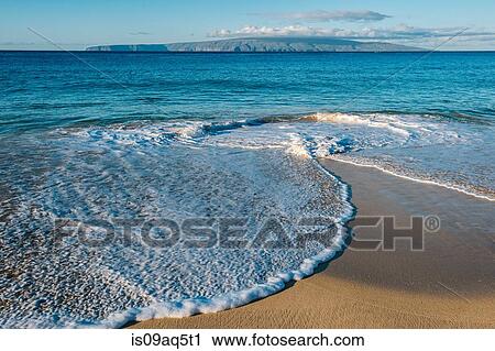 Stock Image - "Ocean tides on beach, Maui, Hawaii". Fotosearch