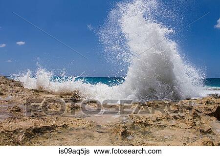 Ocean wave on rocks View Large Photo Image Stock Photograph - Ocean wave on rocks. Fotosearch