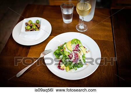 Plate of avocado salad on restaurant table View Large Photo Image Stock Image - Plate of avocado salad on restaurant table. Fotosearch