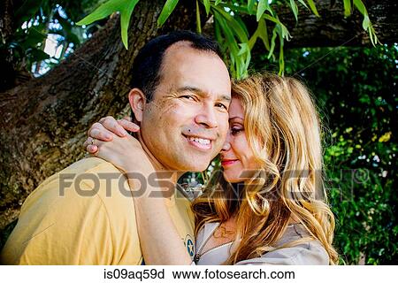 Portrait of affectionate mature couple in garden View Large Photo Image Stock Image - Portrait of affectionate mature couple in garden. Fotosearch