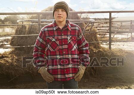 Portrait of boy with hands on hips in dairy farm yard View Large Photo Image Stock Photograph - Portrait of boy with hands on hips in dairy farm yard. Fotosearch