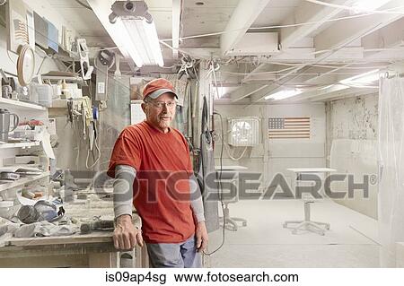 Portrait of cabinet maker leaning against workshop bench in spray booth View Large Photo Image Stock Image - Portrait of cabinet maker leaning against workshop bench in spray booth. Fotosearch