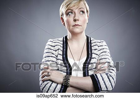 "Portrait of mature woman, arms crossed, looking away" View Large Photo Image Stock Image - "Portrait of mature woman, arms crossed, looking away". Fotosearch