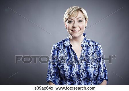 "Portrait of mature woman, looking at camera, smiling" View Large Photo Image Stock Photo - "Portrait of mature woman, looking at camera, smiling". Fotosearch