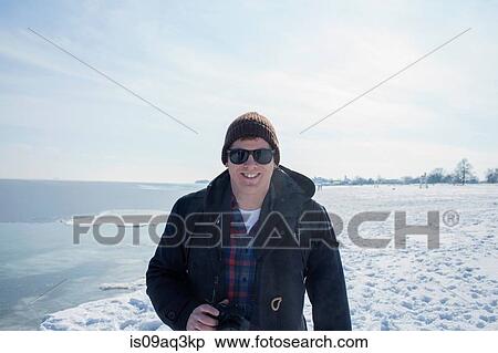 Portrait of mid adult man against snowy backdrop View Large Photo Image Stock Photography - Portrait of mid adult man against snowy backdrop. Fotosearch