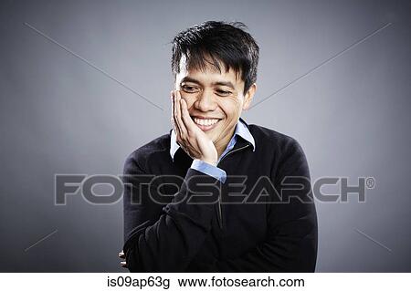 "Portrait of mid adult man, hand on chin, smiling" View Large Photo Image Stock Image - "Portrait of mid adult man, hand on chin, smiling". Fotosearch