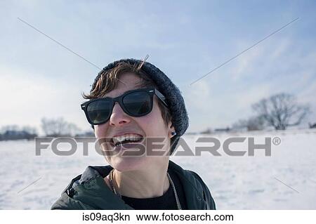 "Portrait of mid adult woman, laughing, against snowy backdrop" View Large Photo Image Picture - "Portrait of mid adult woman, laughing, against snowy backdrop". Fotosearch