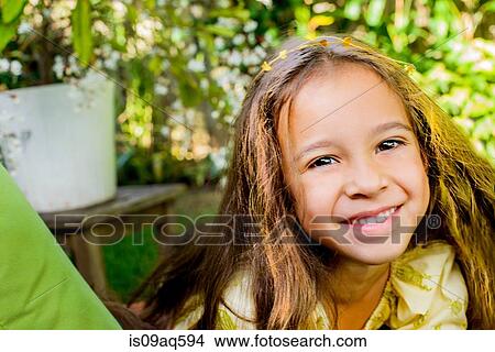 Portrait of pretty smiling girl in garden View Large Photo Image Picture - Portrait of pretty smiling girl in garden. Fotosearch