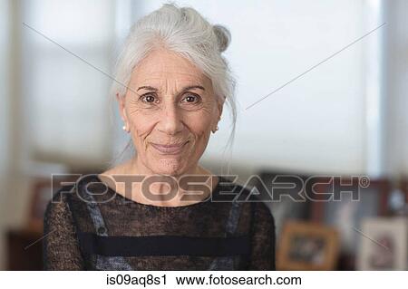 Stock Image - Portrait of smiling senior woman. Fotosearch