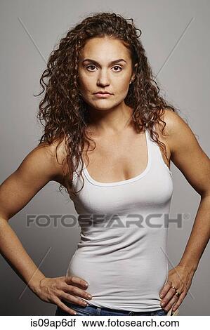 Stock Image - Portrait of woman in tank top. Fotosearch