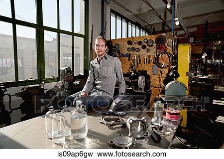 Portrait of young male vodka distiller in distillery workshop View Large Photo Image Stock Photo - Portrait of young male vodka distiller in distillery workshop. Fotosearch