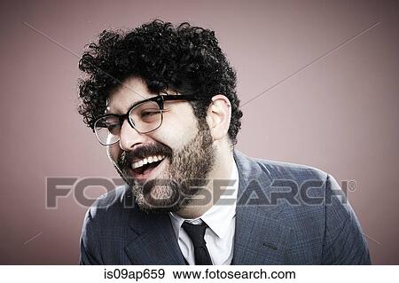 "Portrait of young man, looking away, laughing" View Large Photo Image Stock Photo - "Portrait of young man, looking away, laughing". Fotosearch