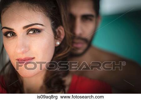 Portrait of young woman looking at camera View Large Photo Image Stock Image - Portrait of young woman looking at camera. Fotosearch