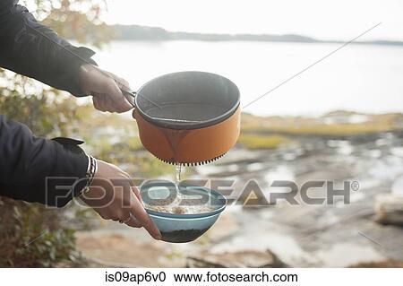 "Preparing food at lakeside, Maine, USA" View Large Photo Image Stock Image - "Preparing food at lakeside, Maine, USA". Fotosearch