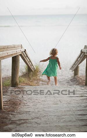 "Rear view of female toddler toddling down to beach, Anna Maria Island, Florida, USA" View Large Photo Image Stock Image - "Rear view of female toddler toddling down to beach, Anna Maria Island, Florida, USA". Fotosearch