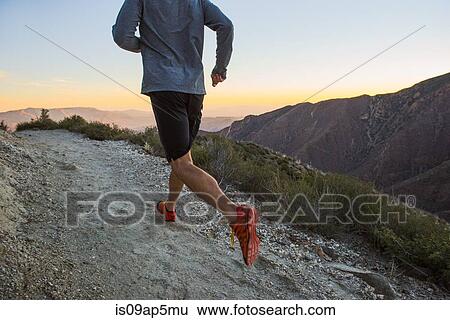 "Rear view of man trail running up dirt track at dusk on Pacific Crest Trail, Pine Valley, California, USA" View Large Photo Image Stock Photograph - "Rear view of man trail running up dirt track at dusk on Pacific Crest Trail, Pine Valley, California, USA". Fotosearch