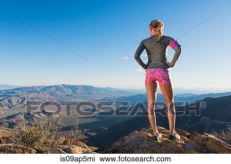 "Rear view of young female trail runner looking out over Pacific Crest Trail, Pine Valley, California, USA" View Large Photo Image Stock Image - "Rear view of young female trail runner looking out over Pacific Crest Trail, Pine Valley, California, USA". Fotosearch