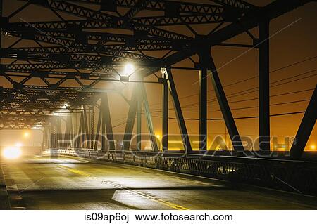 "Road and silhouetted iron bridge at night, Tacoma, Washington, USA" View Large Photo Image Stock Image - "Road and silhouetted iron bridge at night, Tacoma, Washington, USA". Fotosearch