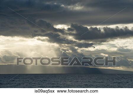 "Seascape of storm clouds and sunbeams, Maui, Hawaii" View Large Photo Image Stock Photo - "Seascape of storm clouds and sunbeams, Maui, Hawaii". Fotosearch