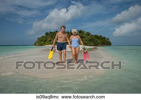 Stock Image - "Senior couple on holiday, Maldives". Fotosearch