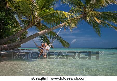 "Senior couple relaxing in hammock, Maldives" View Large Photo Image Stock Image - "Senior couple relaxing in hammock, Maldives". Fotosearch