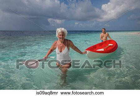"Senior couple with canoe, Maldives" View Large Photo Image Stock Photography - "Senior couple with canoe, Maldives". Fotosearch