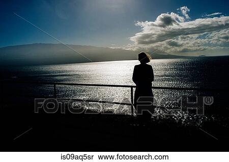 "Silhouetted senior woman looking out to sea, Maui, Hawaii" View Large Photo Image Stock Photography - "Silhouetted senior woman looking out to sea, Maui, Hawaii". Fotosearch