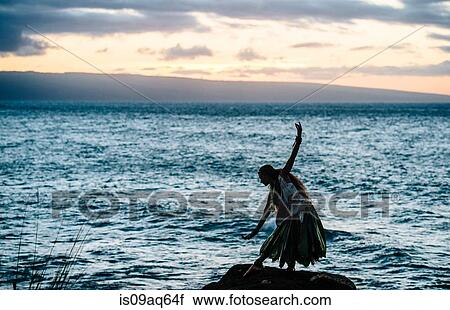 "Silhouetted woman hula dancing on coastal rocks wearing traditional costume at dusk, Maui, Hawaii, USA" View Large Photo Image Stock Image - "Silhouetted woman hula dancing on coastal rocks wearing traditional costume at dusk, Maui, Hawaii, USA". Fotosearch