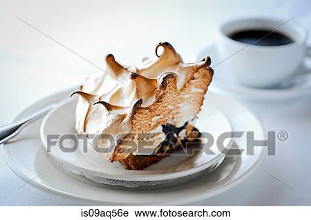 Slice of meringue pie with chocolate on restaurant table View Large Photo Image Stock Image - Slice of meringue pie with chocolate on restaurant table. Fotosearch