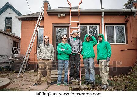 Solar panel installation crew outside a house View Large Photo Image Picture - Solar panel installation crew outside a house. Fotosearch
