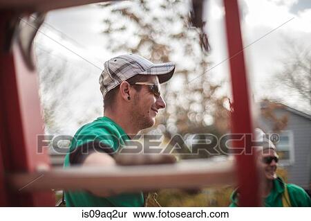 Solar panel installation crew seen through a ladder View Large Photo Image Stock Photography - Solar panel installation crew seen through a ladder. Fotosearch