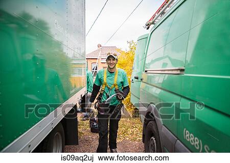Solar panel installation worker walking in between truck and van View Large Photo Image Stock Image - Solar panel installation worker walking in between truck and van. Fotosearch