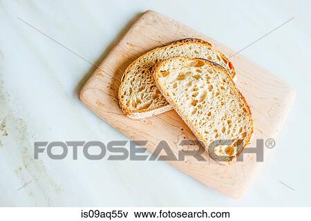 Still life with toast and cutting board View Large Photo Image Stock Photo - Still life with toast and cutting board. Fotosearch