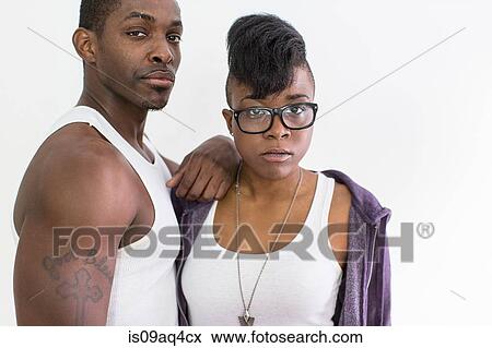 Studio portrait of cool confident couple View Large Photo Image Stock Photo - Studio portrait of cool confident couple. Fotosearch