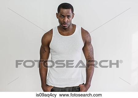 Studio portrait of muscular macho mid adult man View Large Photo Image Stock Photo - Studio portrait of muscular macho mid adult man. Fotosearch