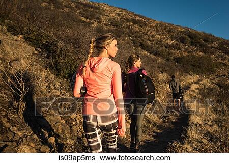 Stock Photograph - "Three adult trail running friends on Pacific Crest Trail, Pine Valley, California, USA". Fotosearch