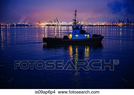 "Tugboat in front of harbor at night, Tacoma, Washington, USA" View Large Photo Image Picture - "Tugboat in front of harbor at night, Tacoma, Washington, USA". Fotosearch