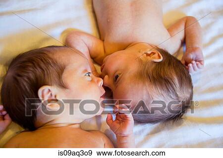 Stock Photo - Twin baby sister and brother. Fotosearch