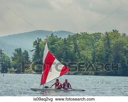 "Two men in a small sailboat on Lake George, New York, USA" View Large Photo Image Stock Image - "Two men in a small sailboat on Lake George, New York, USA". Fotosearch