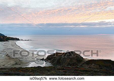 Stock Image - "View of beach at sunset, Big Sur, California, USA". Fotosearch