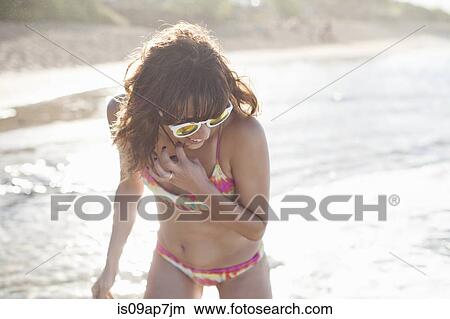 Woman enjoying beach View Large Photo Image Picture - Woman enjoying beach. Fotosearch