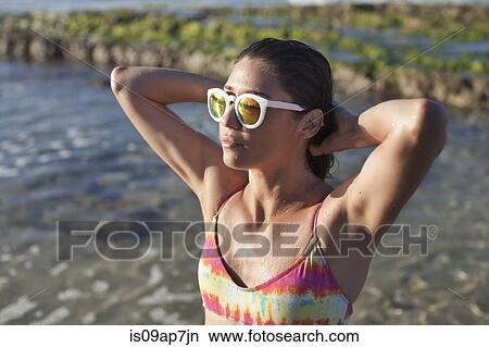 Picture - Woman enjoying beach. Fotosearch