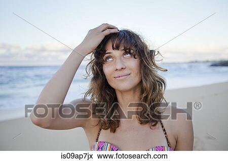 Stock Photo - Woman enjoying beach. Fotosearch