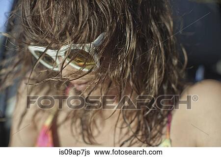 Stock Photograph - Woman wearing sunglasses. Fotosearch