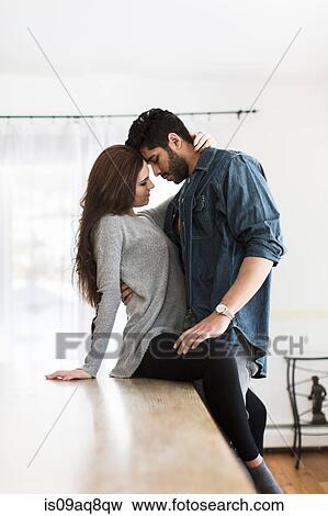 Stock Photo - Young couple hugging. Fotosearch
